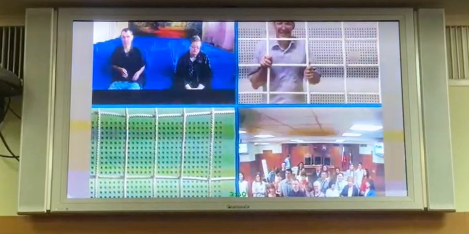 Konstantin Sannikov speaks in court via video link from the detention center